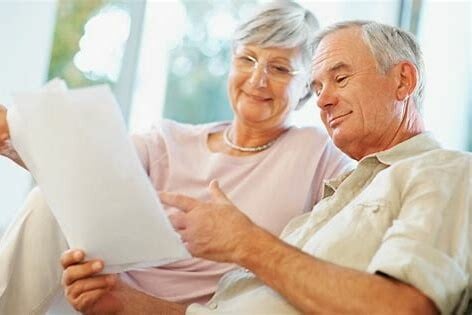 image of elderly couple reviewing finances for memory care communities